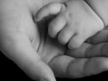 Mother holding her newborn baby
